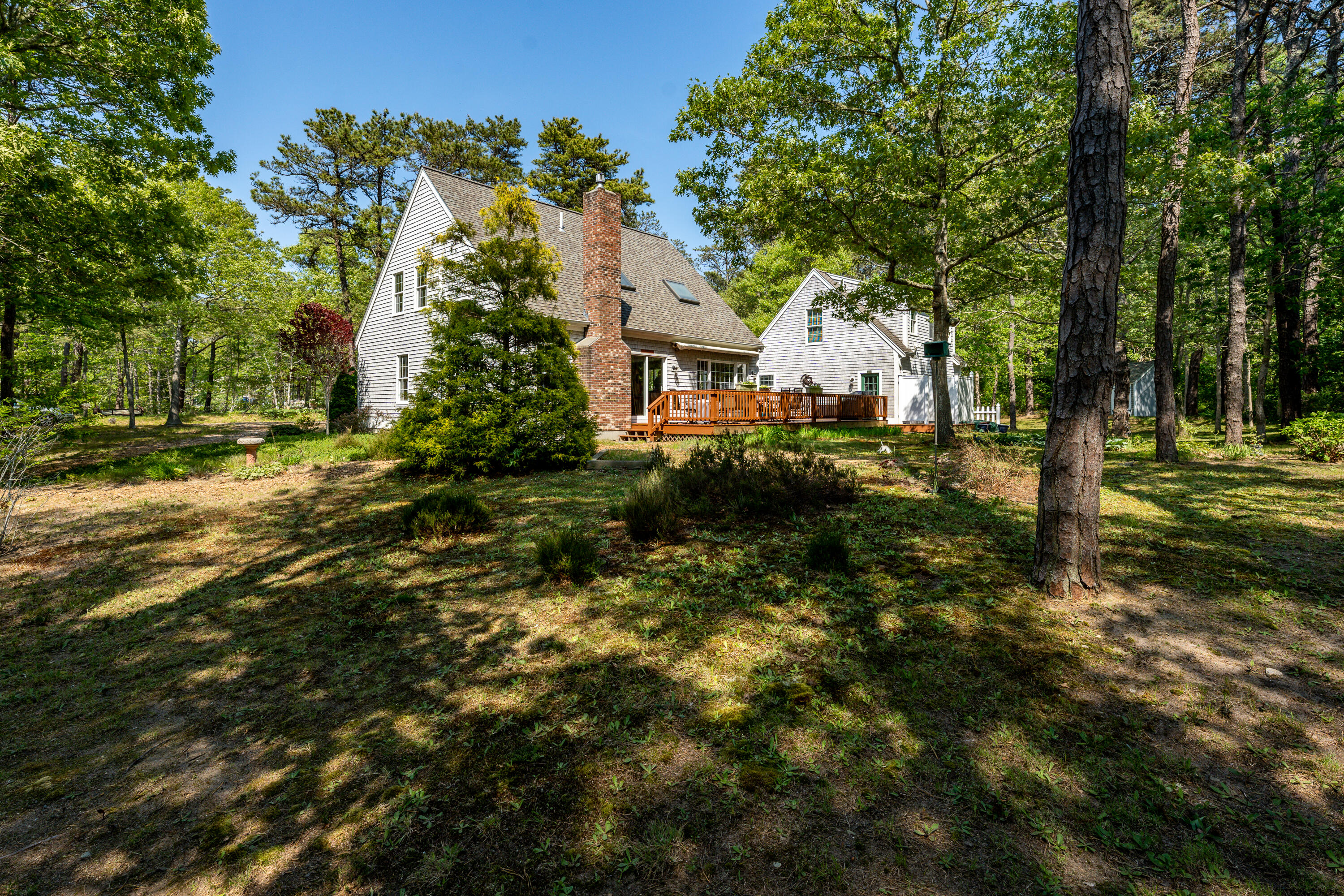 130 Browns Neck Road Wellfleet, MA 02667 - Photo 23 of 40 a front view of a house with a yard