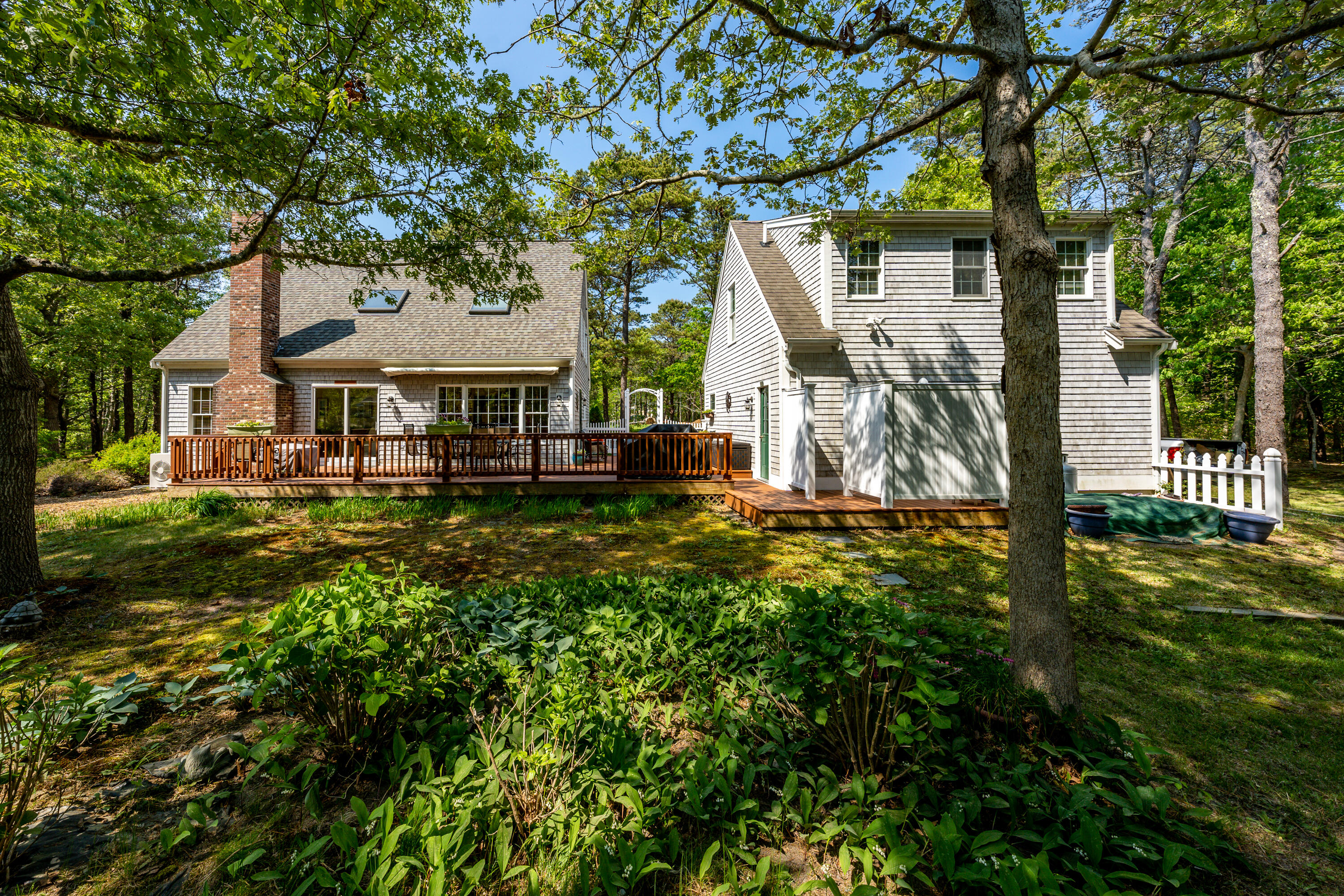 130 Browns Neck Road Wellfleet, MA 02667 - Photo 25 of 40 a front view of a house with a yard