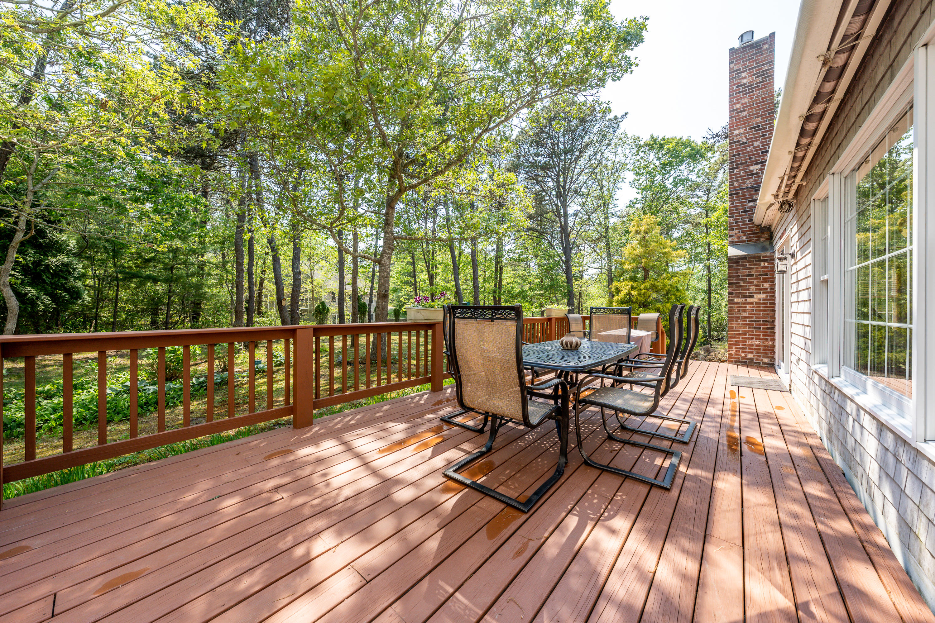 130 Browns Neck Road Wellfleet, MA 02667 - Photo 27 of 40 a view of a chairs on wooden deck
