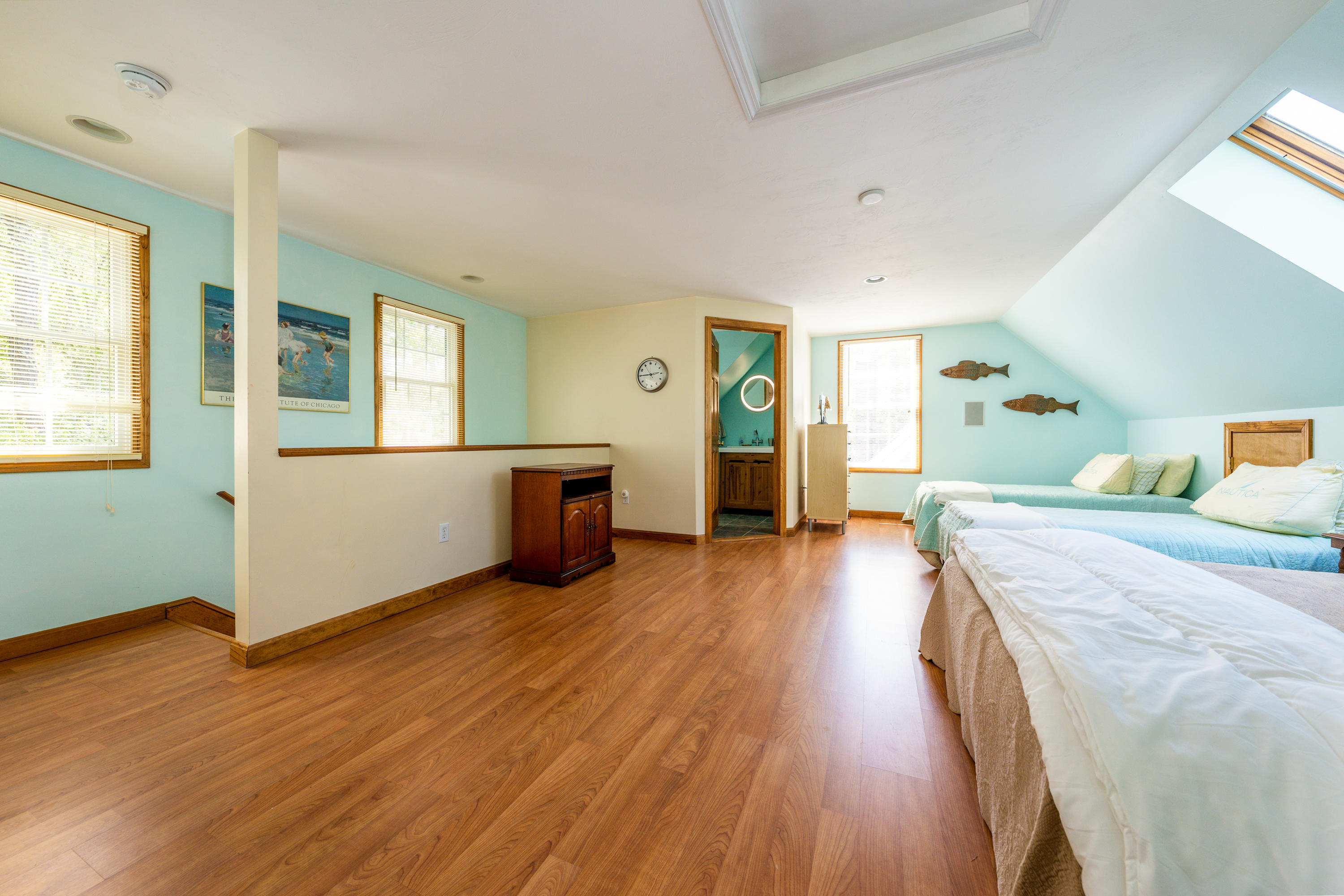 130 Browns Neck Road Wellfleet, MA 02667 - Photo 33 of 40 a spacious bedroom with wooden floor and windows
