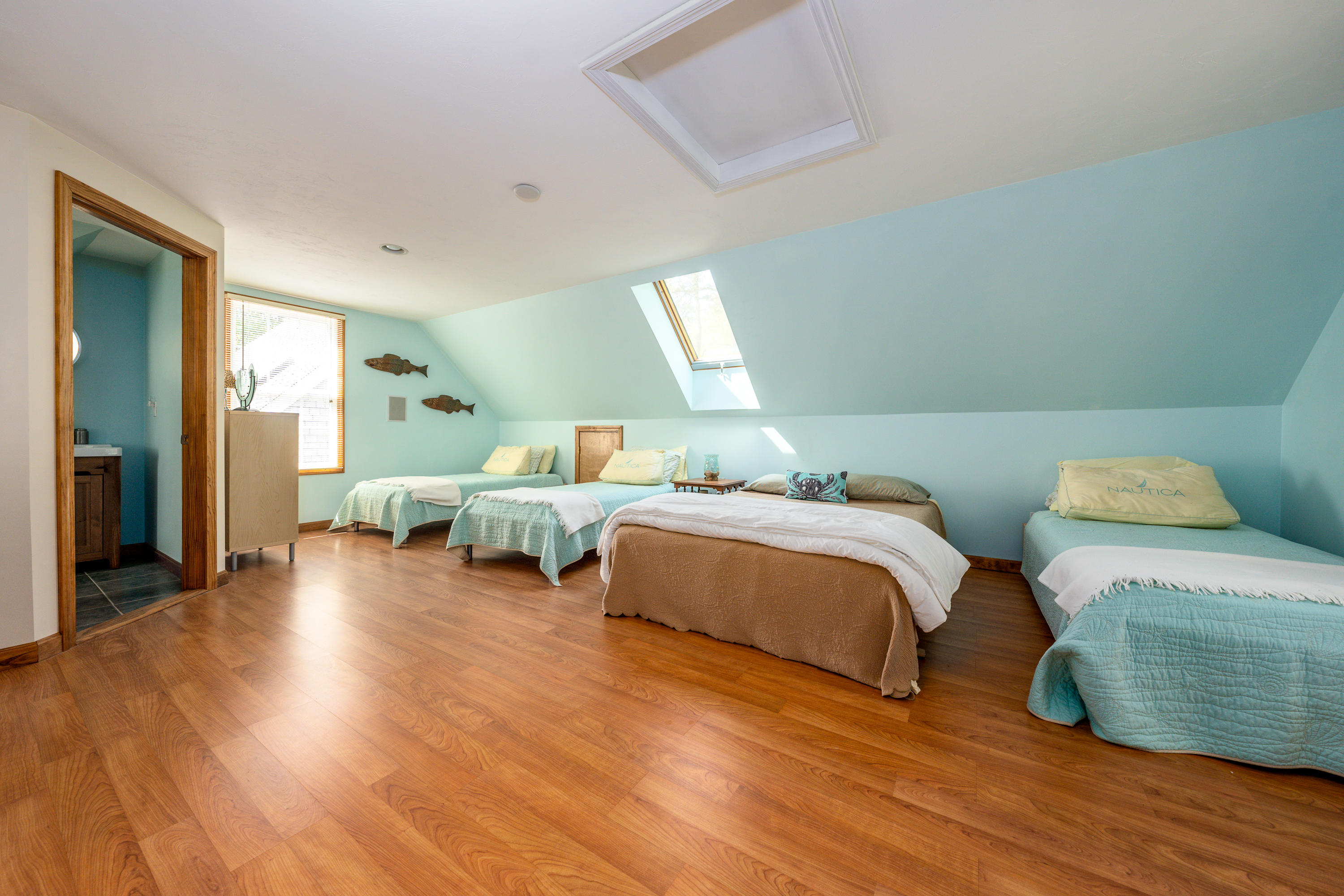 130 Browns Neck Road Wellfleet, MA 02667 - Photo 34 of 40 a spacious bedroom with a bed and a couch