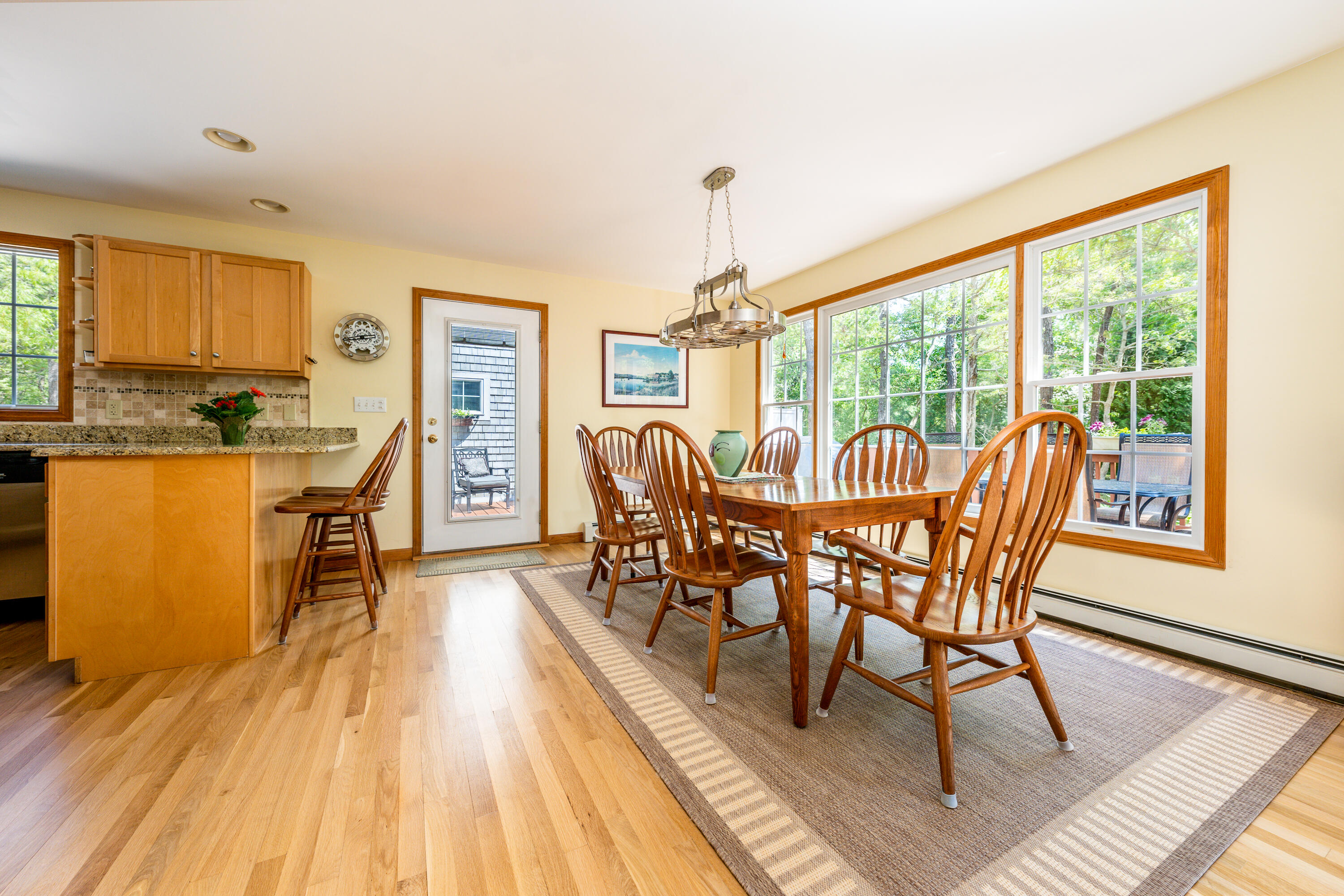 130 Browns Neck Road Wellfleet, MA 02667 - Photo 9 of 40 a view of a dining room with furniture window and wooden floor