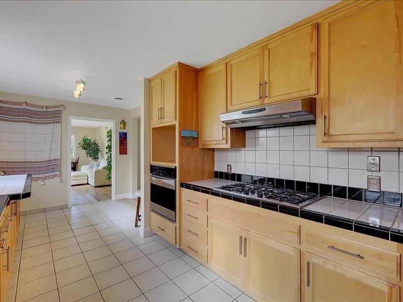 13001 Yuba-Nevada Road Dobbins, CA 95935 - Photo 6 of 63 a kitchen with stainless steel appliances granite countertop a stove a sink and a refrigerator