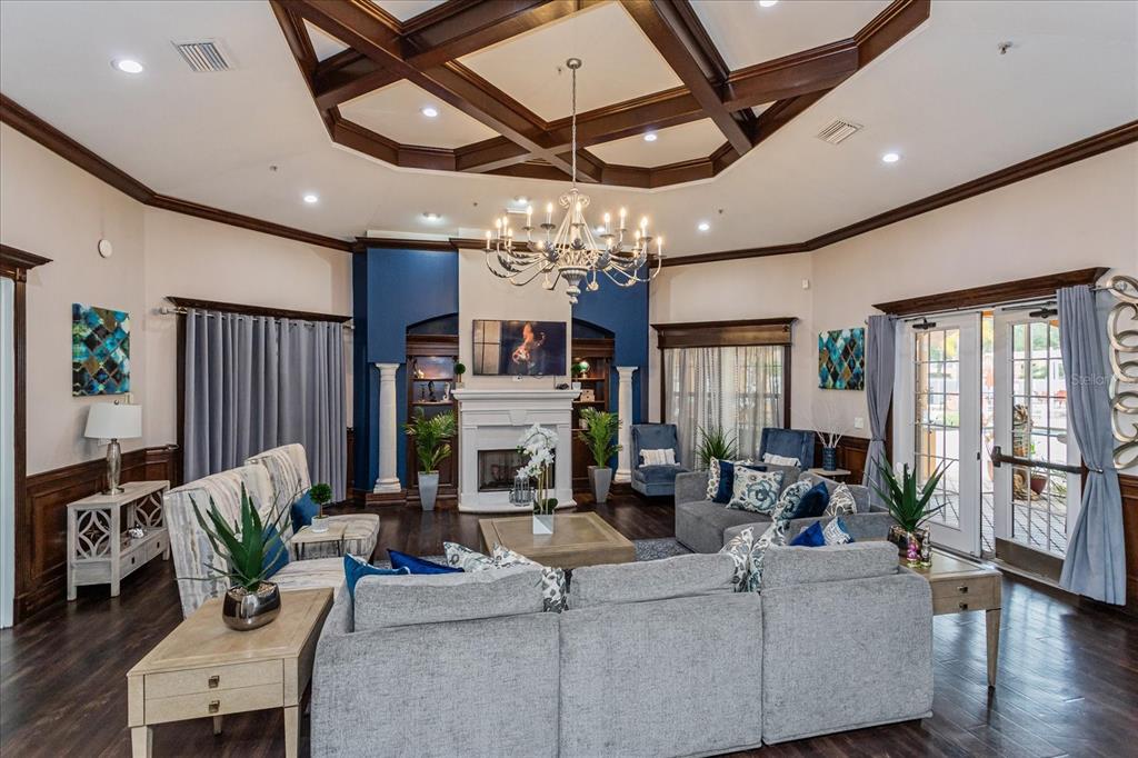 5455 Vineland Road, Unit 3214 Orlando, FL 32811 - Photo 16 of 25 a living room with fireplace furniture and a chandelier
