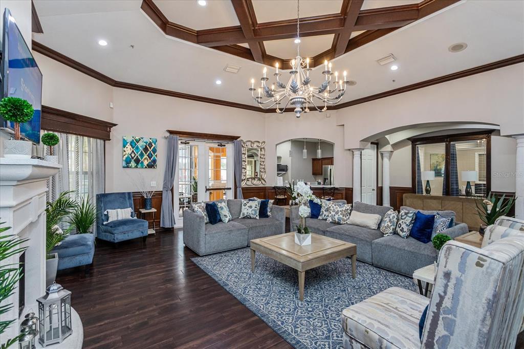 5455 Vineland Road, Unit 3214 Orlando, FL 32811 - Photo 18 of 25 a living room with furniture or chandelier and a wooden floor