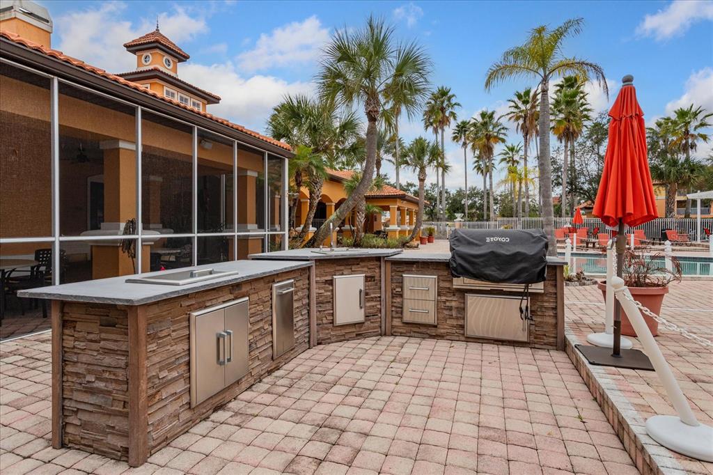 5455 Vineland Road, Unit 3214 Orlando, FL 32811 - Photo 25 of 25 a view of a chairs and table in the patio
