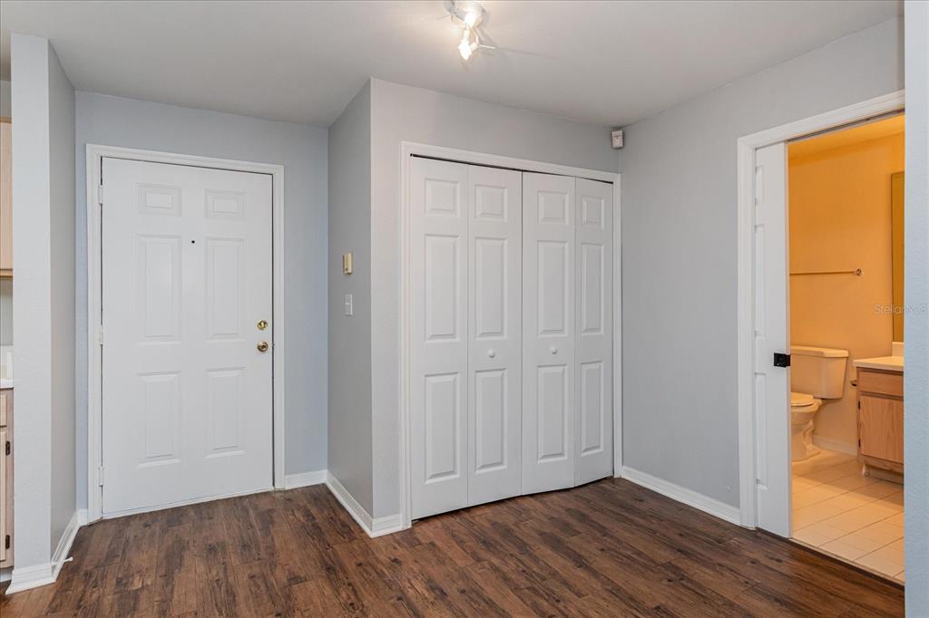 5455 Vineland Road, Unit 3214 Orlando, FL 32811 - Photo 3 of 25 a view of hallway with wooden floor