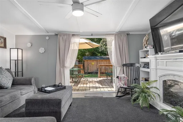 a dining room with furniture a chandelier and window