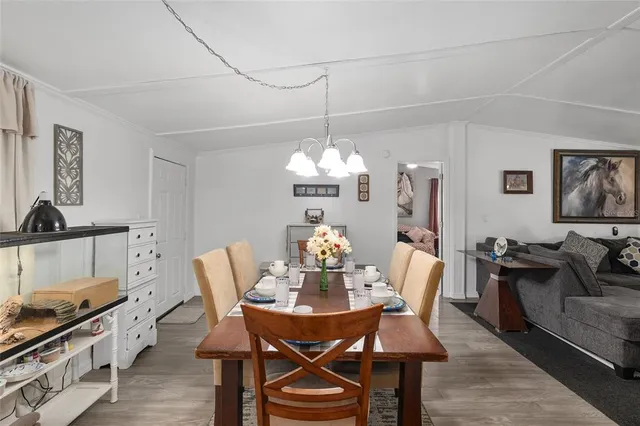 a kitchen with kitchen island granite countertop lots of clutter and stainless steel appliances