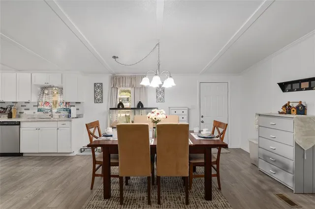 a kitchen with lots of counter top space and appliances