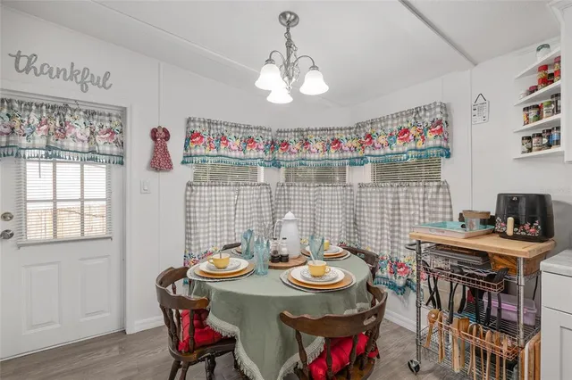a living room with furniture a fireplace and flat screen tv