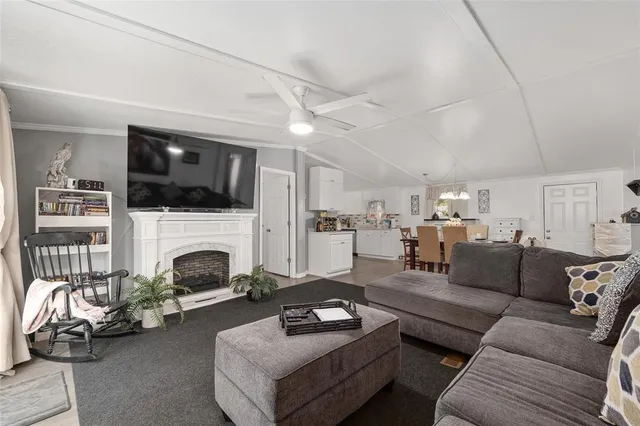 a bedroom with a bed dresser and a window