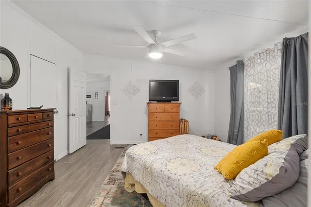 a bathroom with a toilet sink vanity and mirror
