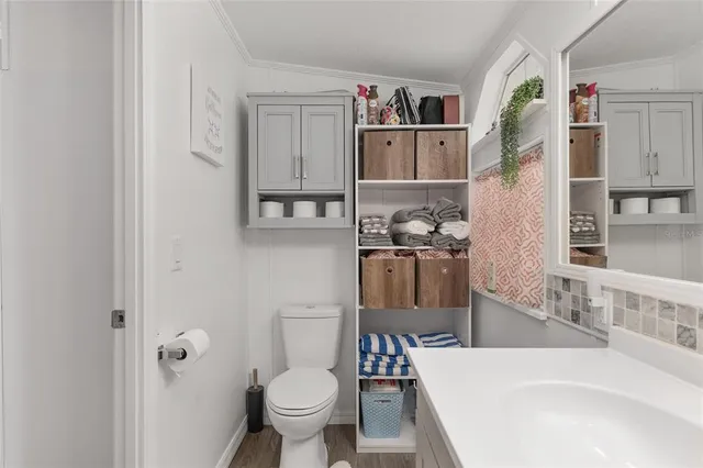 a view of balcony with wooden floor and outdoor seating