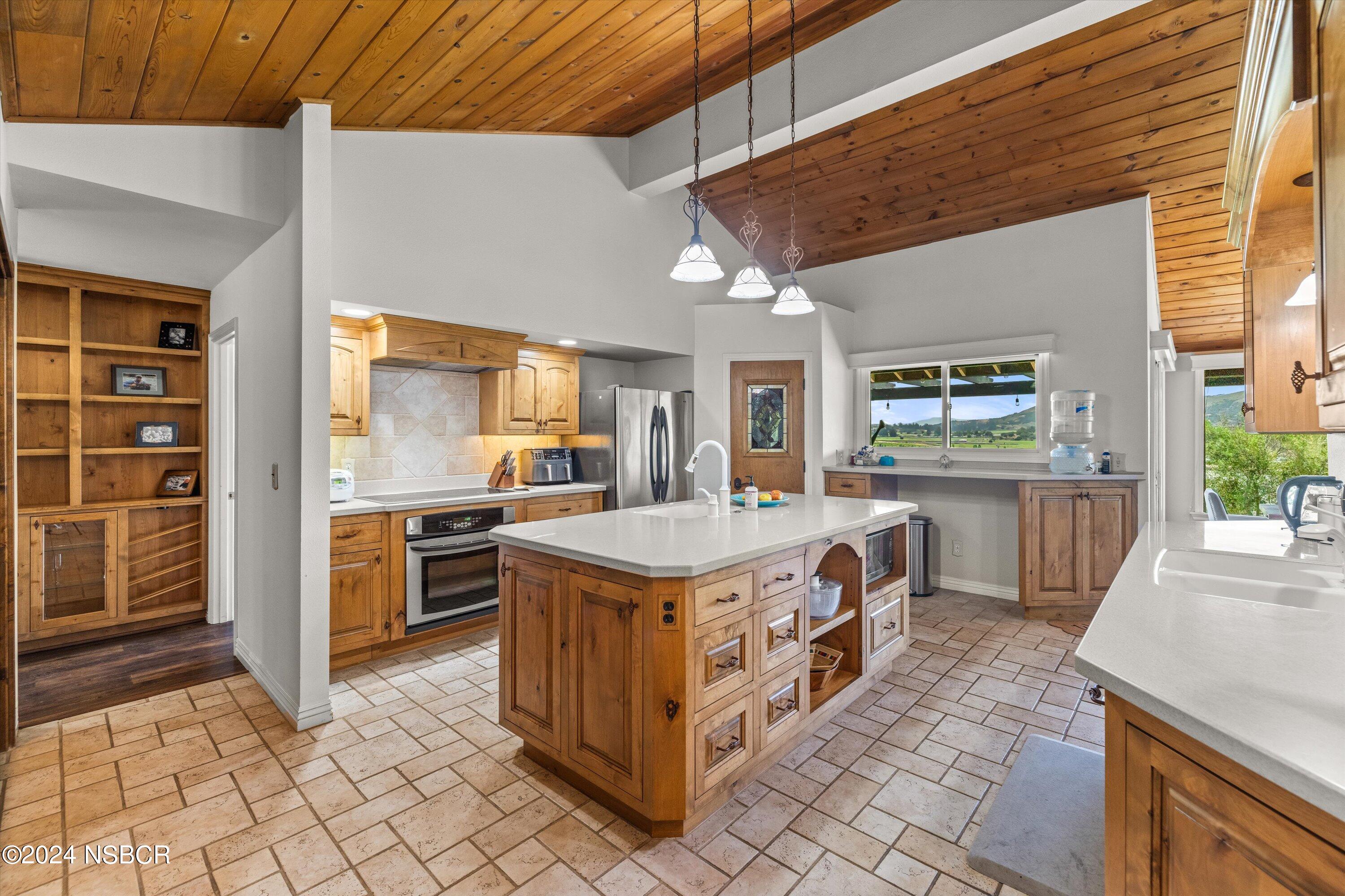 4281 Highway 246 Lompoc, CA 93436 - Photo 11 of 60 a kitchen with stainless steel appliances granite countertop a stove and a sink