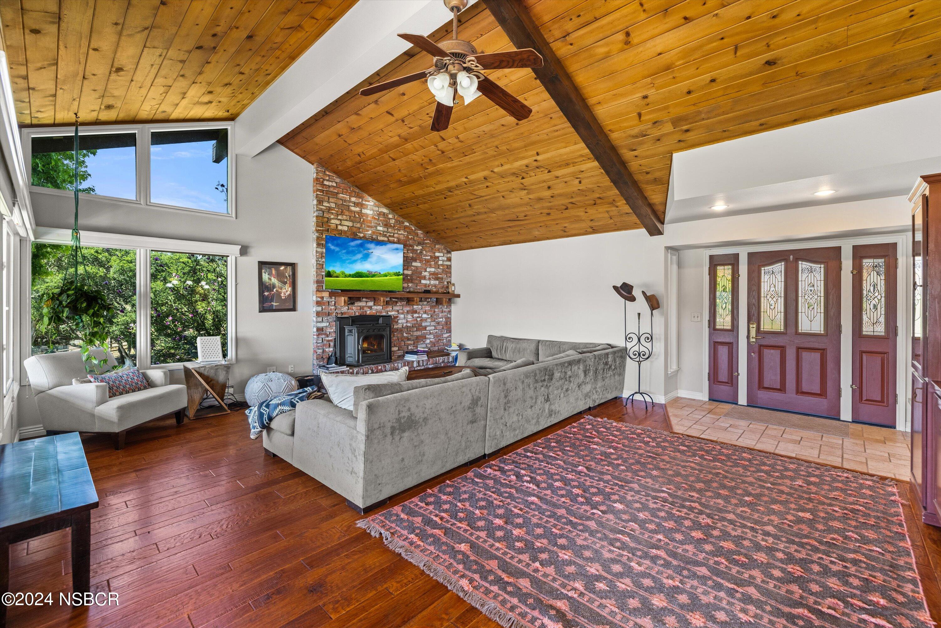 4281 Highway 246 Lompoc, CA 93436 - Photo 15 of 60 a living room with furniture and a fireplace