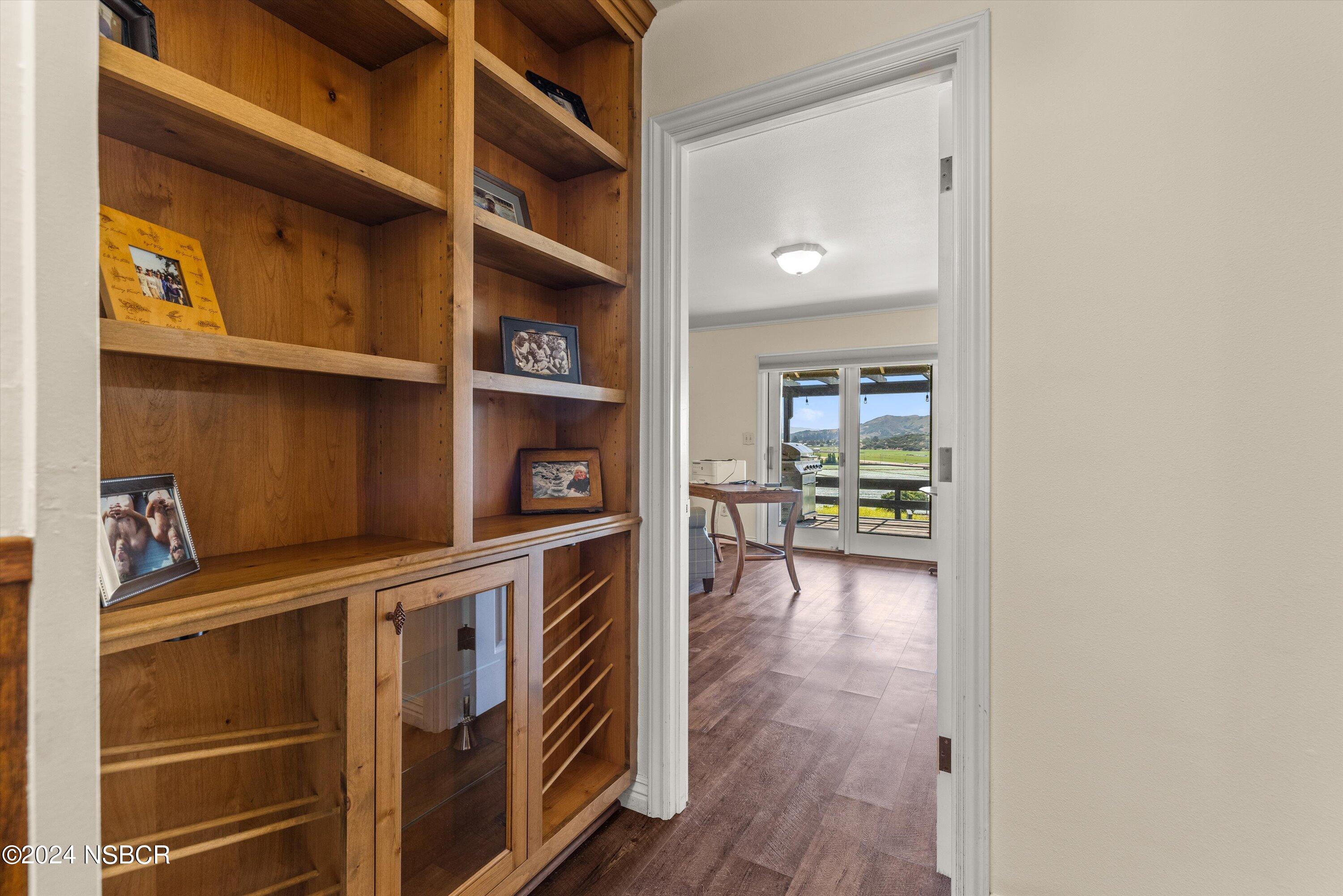 4281 Highway 246 Lompoc, CA 93436 - Photo 19 of 60 a view of an empty room with wooden floor and a cabinet