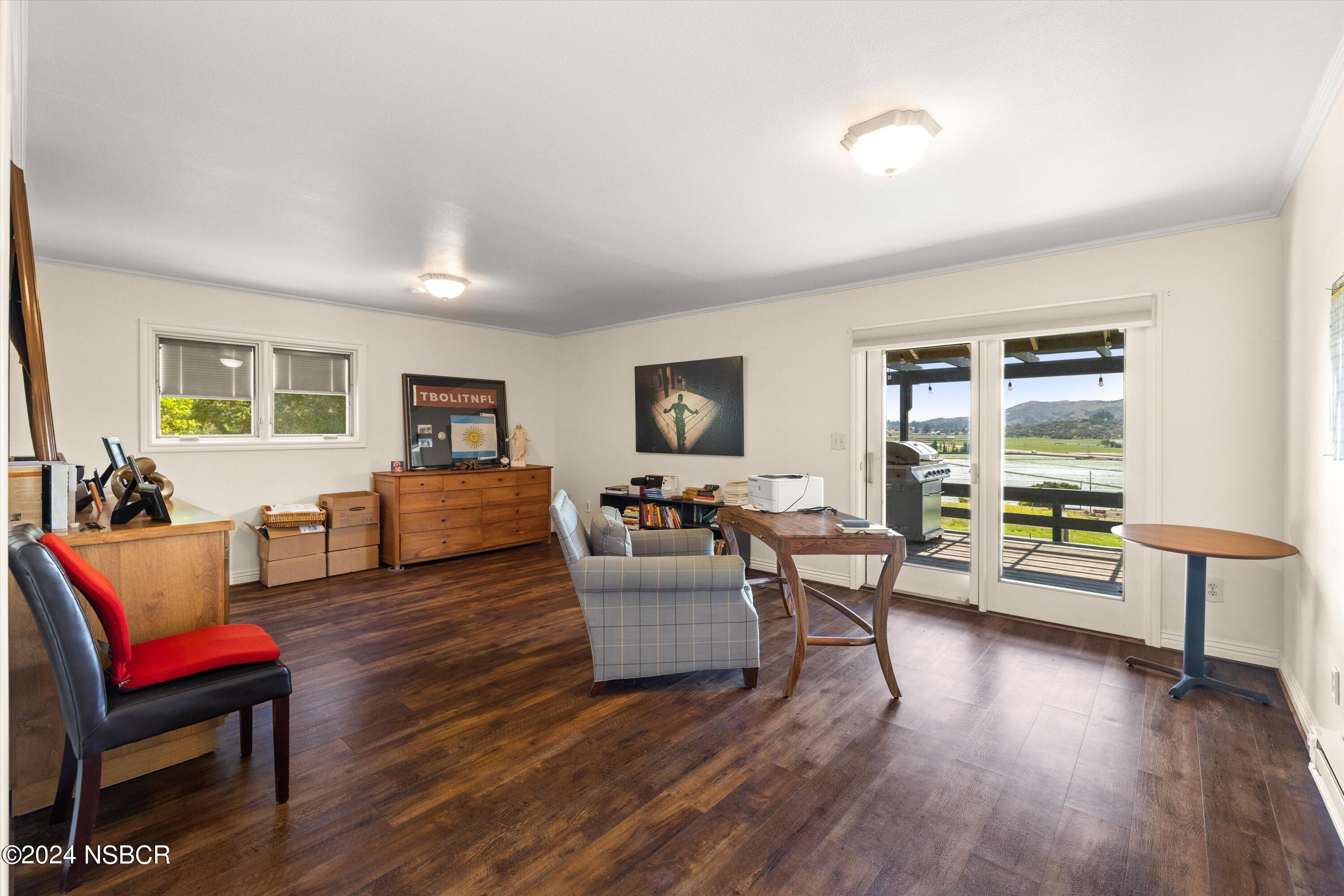 4281 Highway 246 Lompoc, CA 93436 - Photo 20 of 60 a living room with furniture and a wooden floor