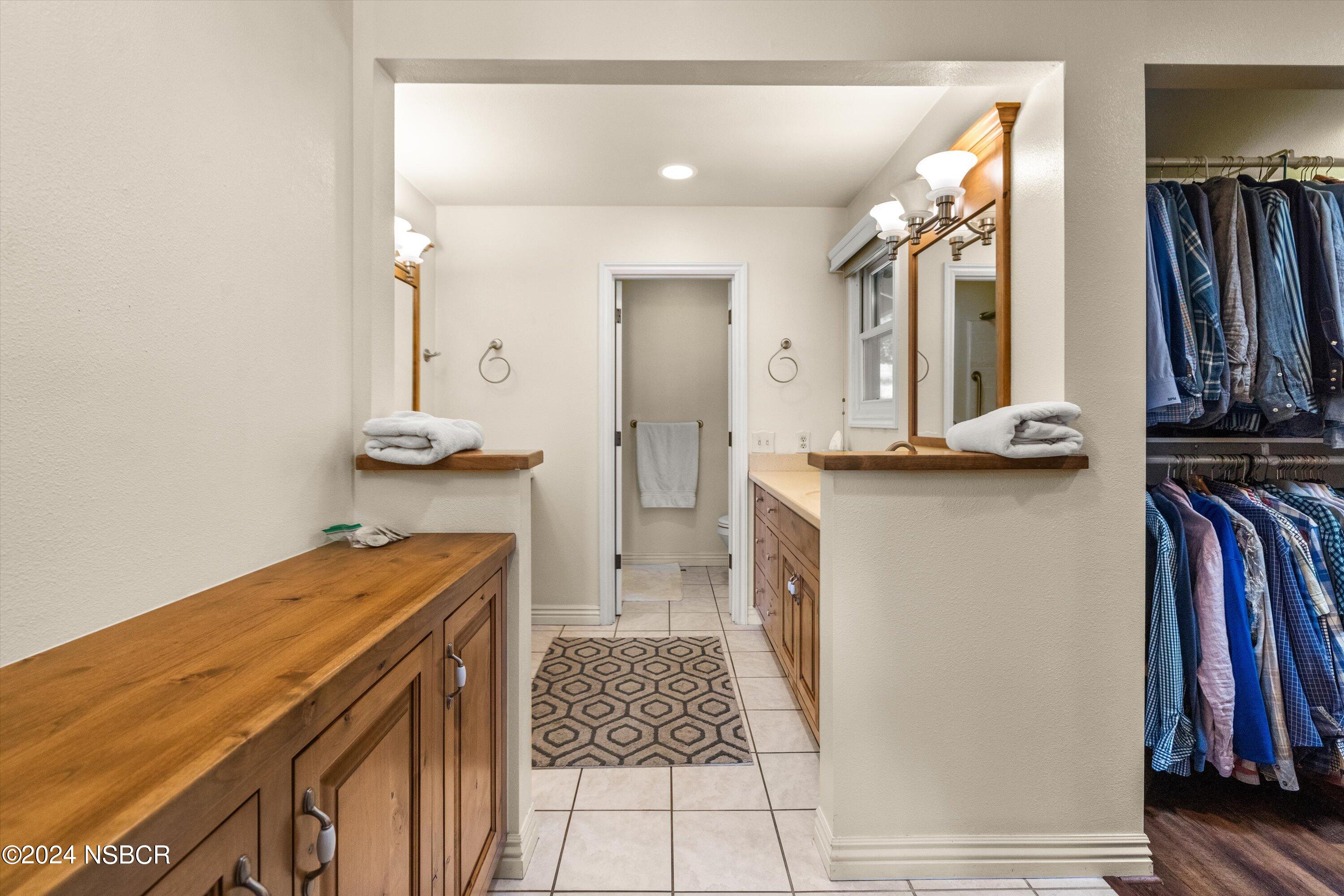 4281 Highway 246 Lompoc, CA 93436 - Photo 22 of 60 a view of walk in closet with clothes and shoes