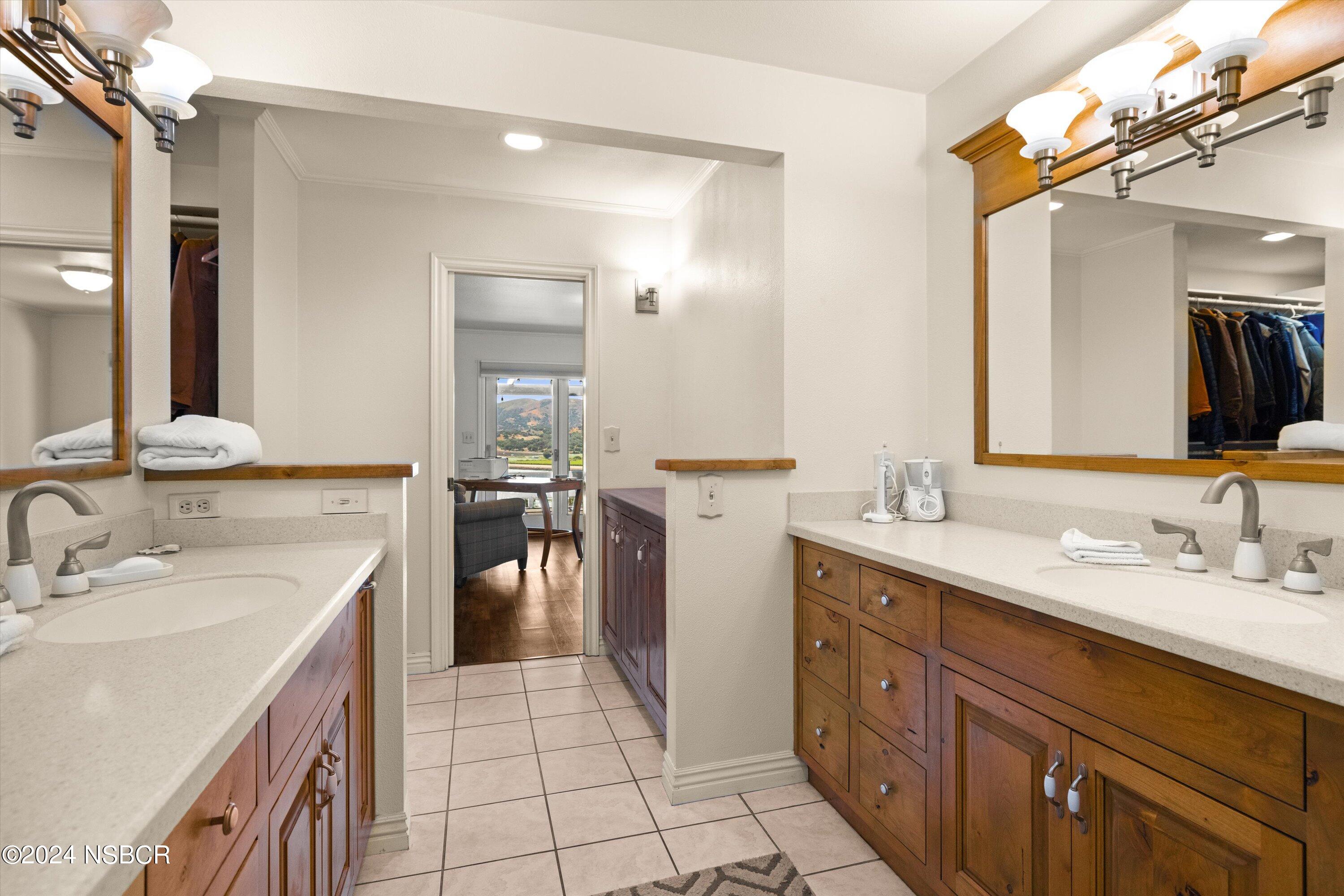 4281 Highway 246 Lompoc, CA 93436 - Photo 24 of 60 a spacious bathroom with a double vanity sink and a mirror