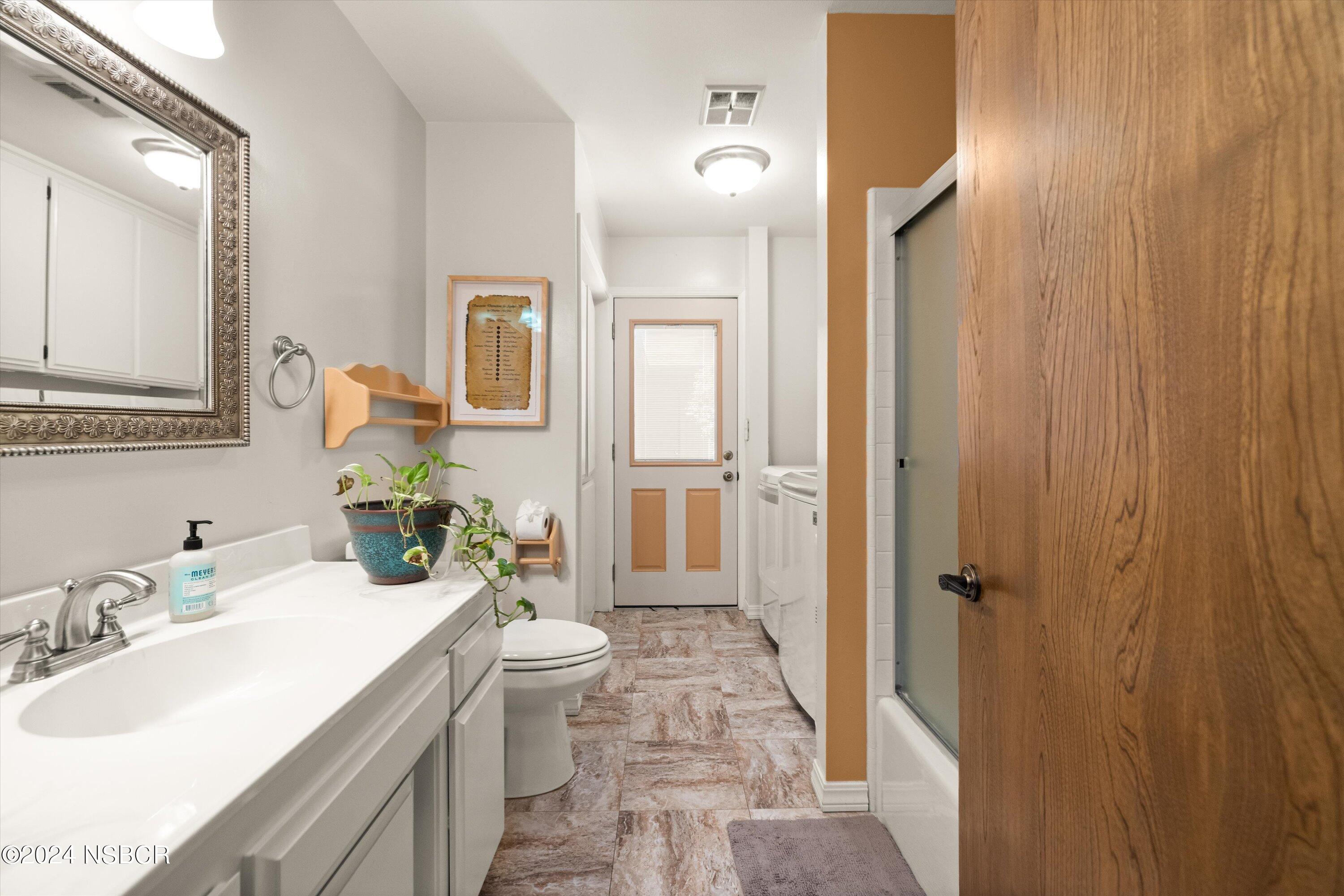 4281 Highway 246 Lompoc, CA 93436 - Photo 27 of 60 a bathroom with a sink a toilet and shower