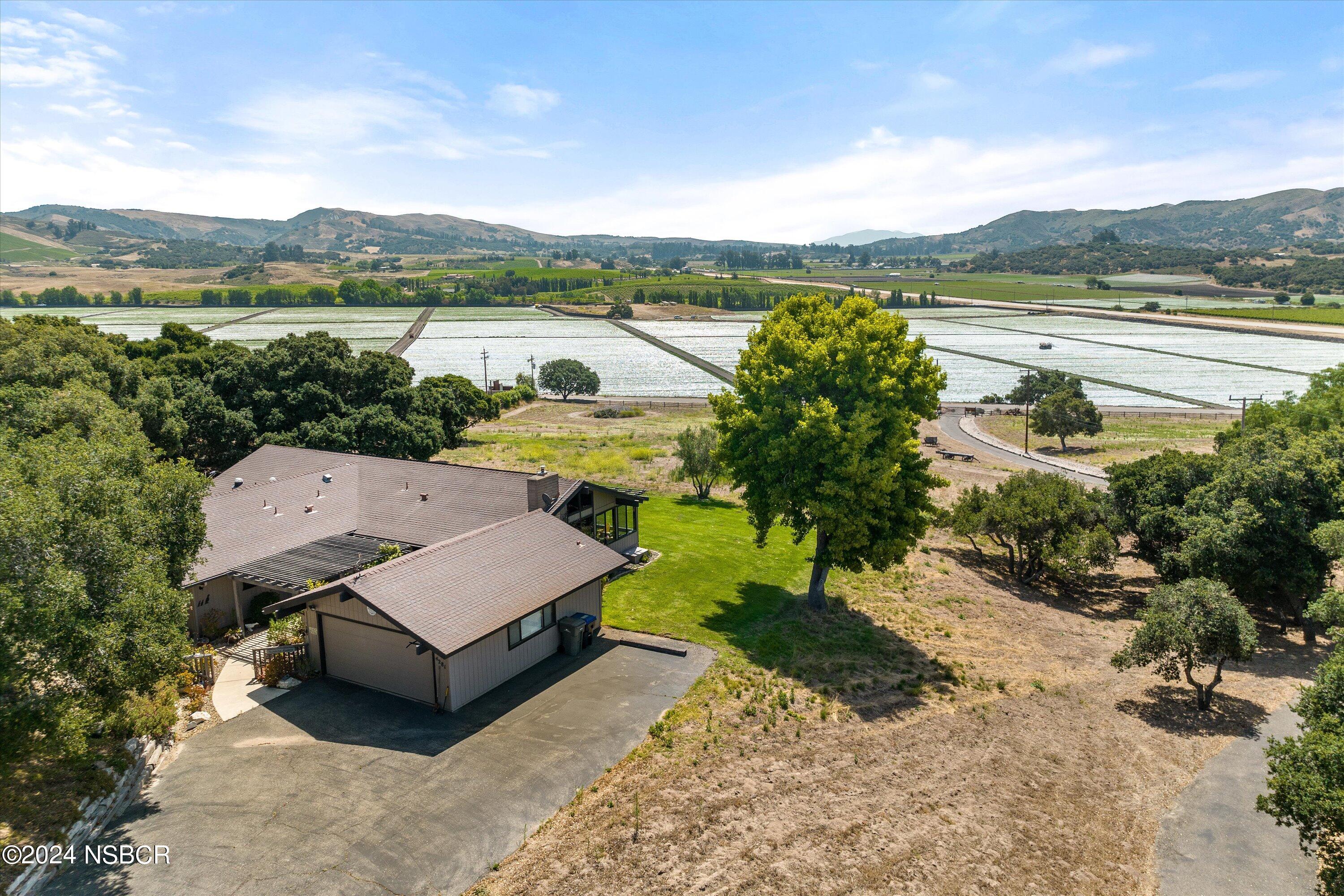 4281 Highway 246 Lompoc, CA 93436 - Photo 54 of 60 a view of a terrace with a garden and lake view