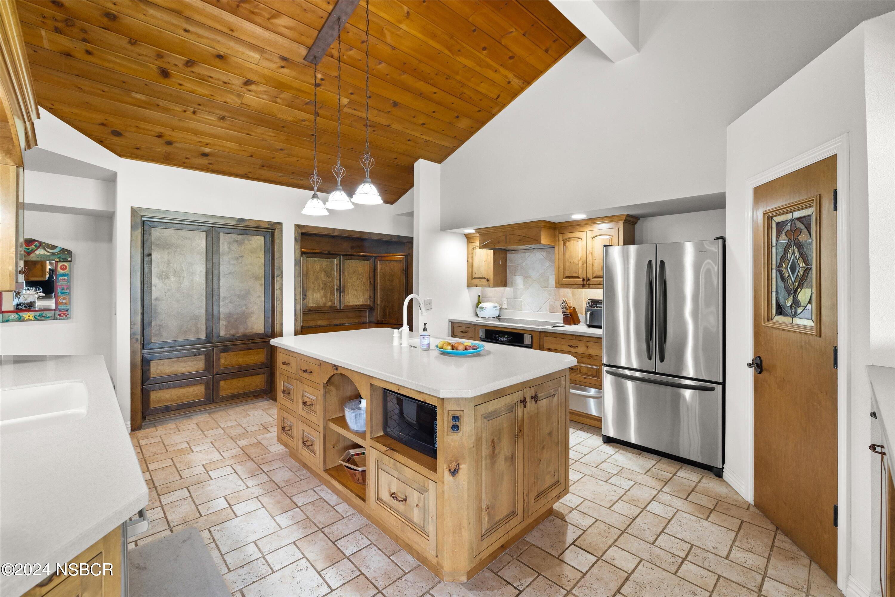 4281 Highway 246 Lompoc, CA 93436 - Photo 10 of 60 a kitchen that has a lot of cabinets in it and wooden floor