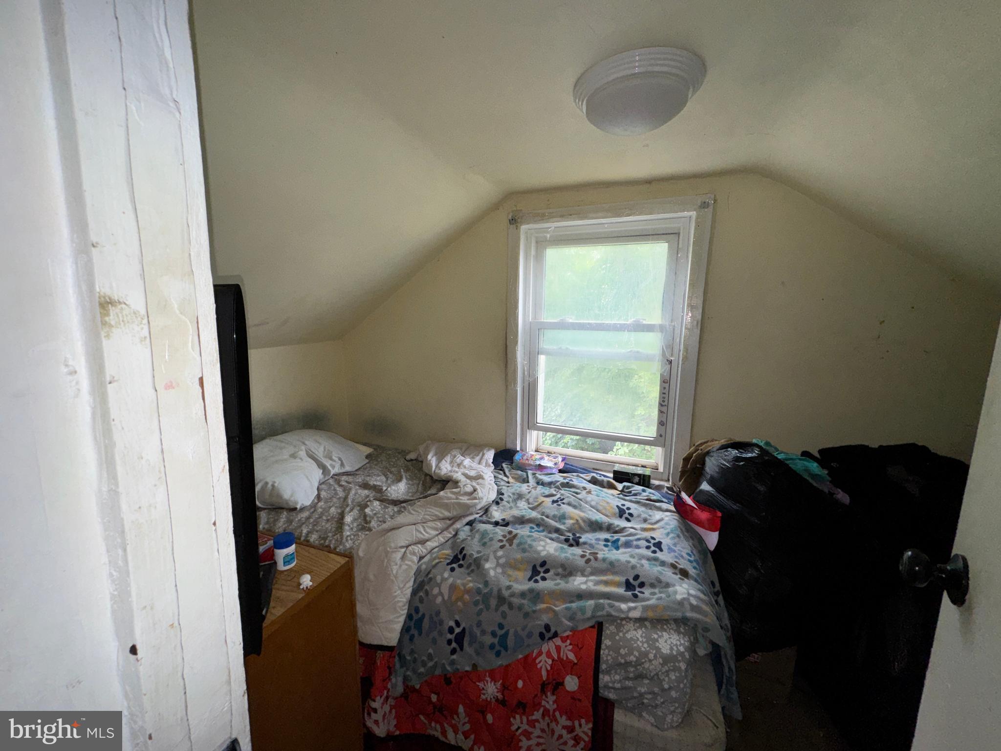 131 Modena Road Coatesville, PA 19320 - Photo 21 of 25 a bed sitting in a bedroom next to a window
