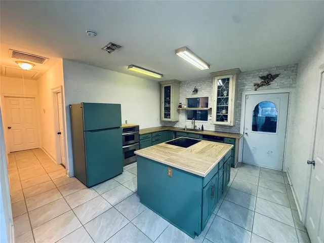 a kitchen with a cabinets and counter space