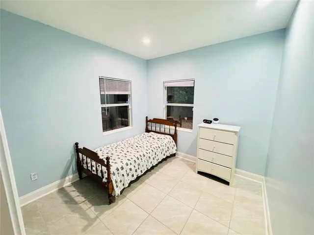 a room with a bed and a window