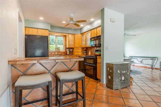 a bedroom with a large bed and a large window