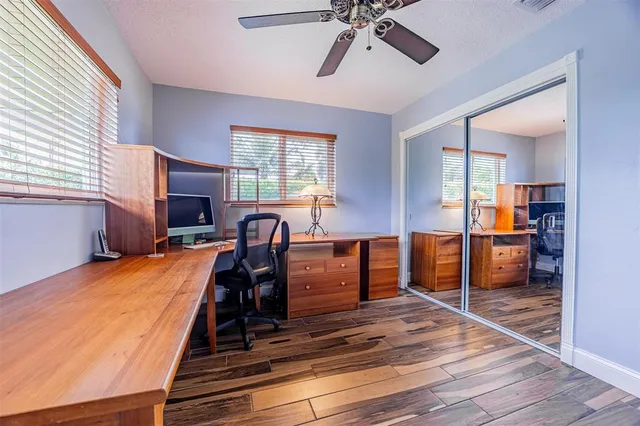 a view of yard with seating area and trees around