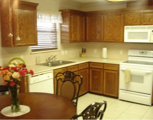 a kitchen with a sink cabinets and appliances