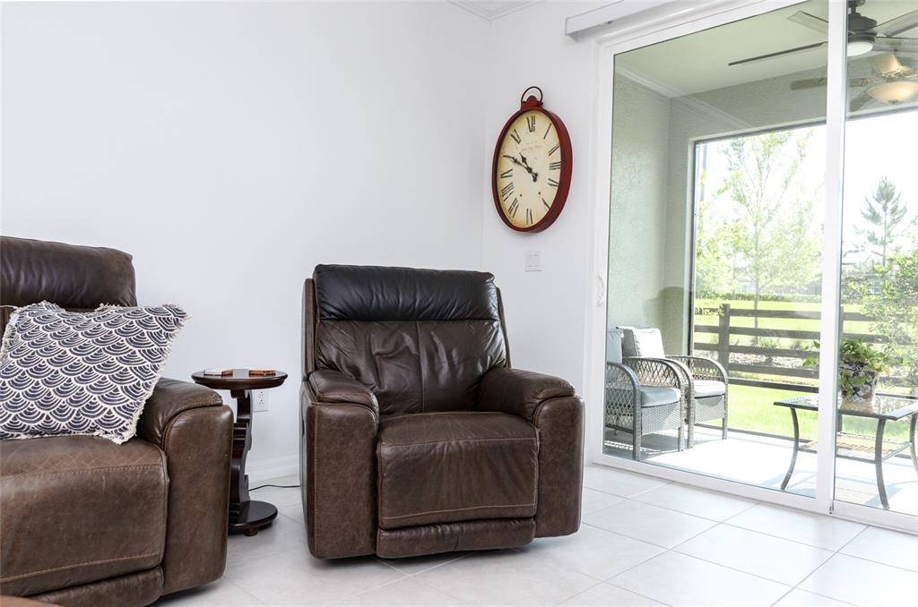 6736 Ripple Pond Loop Zephyrhills, FL 33541 - Photo 18 of 40 a living room with furniture and a large window