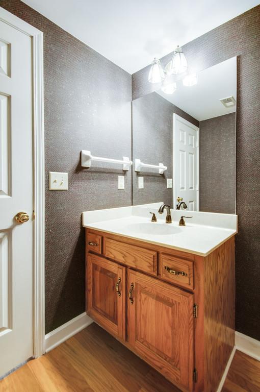 520 General George Patton Road Nashville, TN 37221 - Photo 17 of 30 a bathroom with a double vanity sink and a mirror