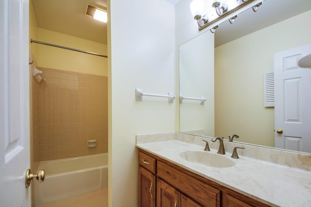 520 General George Patton Road Nashville, TN 37221 - Photo 23 of 30 a bathroom with a granite countertop sink and a mirror