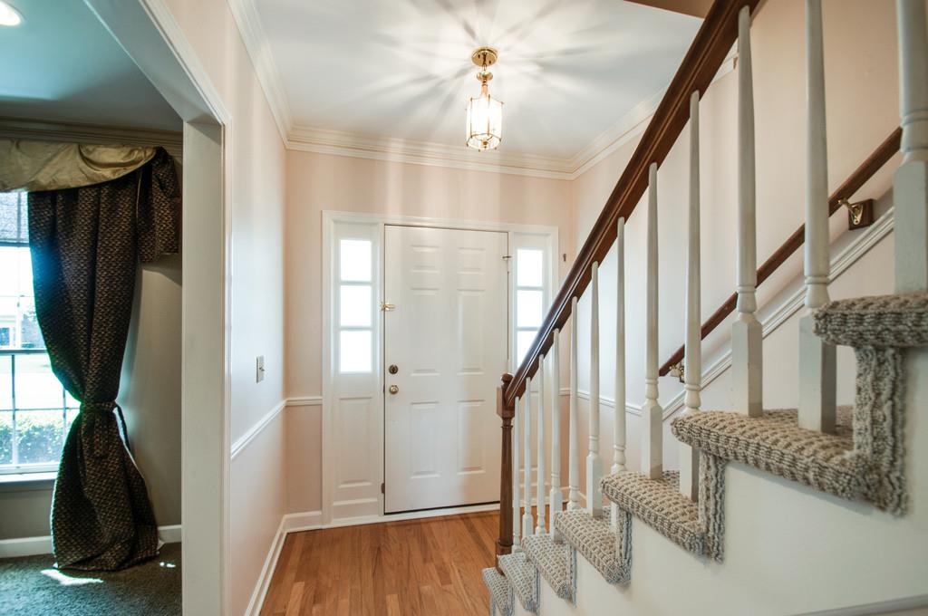 520 General George Patton Road Nashville, TN 37221 - Photo 5 of 30 a view of hallway with stairs and wooden floor