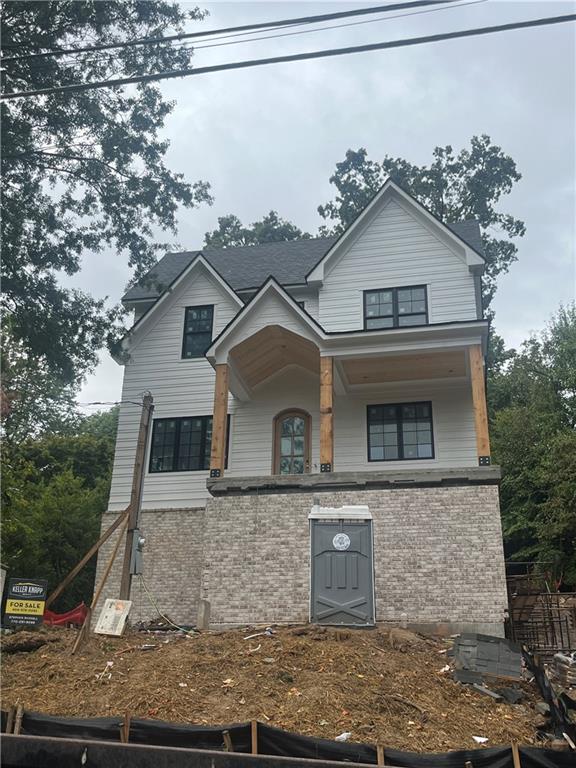 915 Amsterdam Avenue Northeast Atlanta, GA 30306 - Photo 2 of 6 a front view of a house with a yard