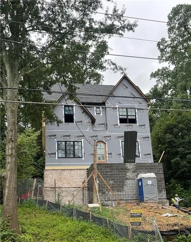 a aerial view of a house with a yard