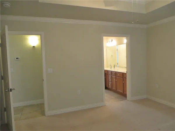a spacious bathroom with a double vanity sink and a mirror