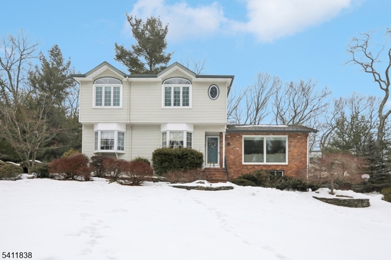 4 Southview Road Randolph, NJ 07869 - Photo 1 of 30 a front view of a house with a yard covered in snow