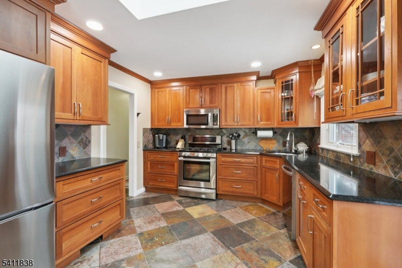 4 Southview Road Randolph, NJ 07869 - Photo 11 of 30 a kitchen with stainless steel appliances granite countertop a refrigerator and stove top oven
