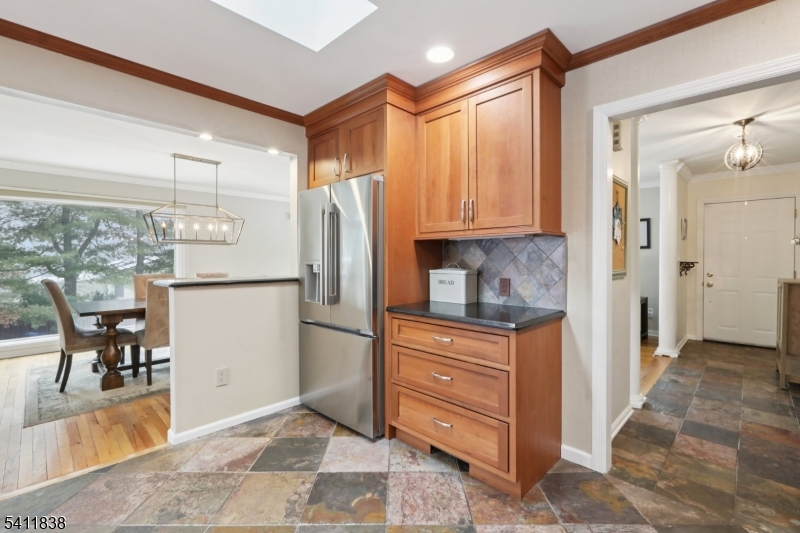 4 Southview Road Randolph, NJ 07869 - Photo 12 of 30 a kitchen with granite countertop a refrigerator and a stove top oven