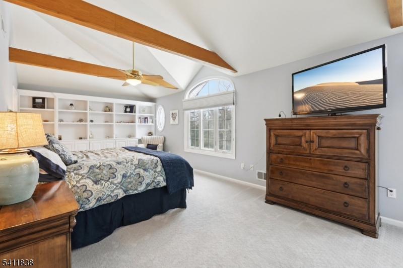 4 Southview Road Randolph, NJ 07869 - Photo 20 of 30 a bedroom with a bed and a flat screen tv