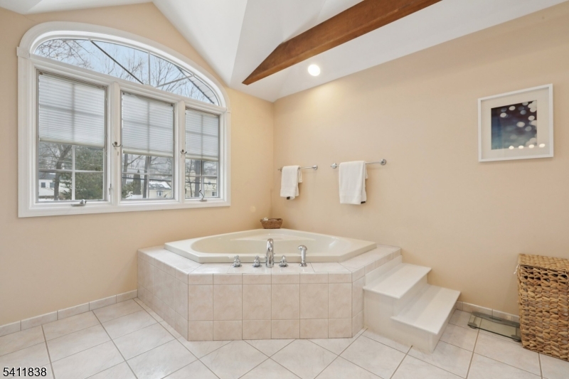 4 Southview Road Randolph, NJ 07869 - Photo 24 of 30 a bath tub sitting in a bathroom next to a window