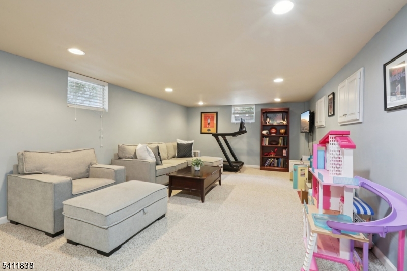 4 Southview Road Randolph, NJ 07869 - Photo 26 of 30 a living room with furniture and a flat screen tv