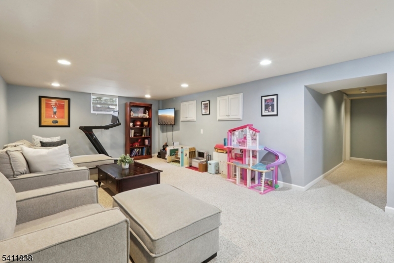 4 Southview Road Randolph, NJ 07869 - Photo 27 of 30 a living room with furniture and a flat screen tv