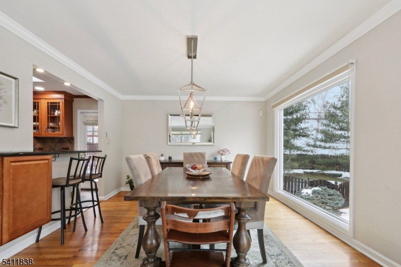 4 Southview Road Randolph, NJ 07869 - Photo 6 of 30 a dining room with furniture a chandelier and wooden floor