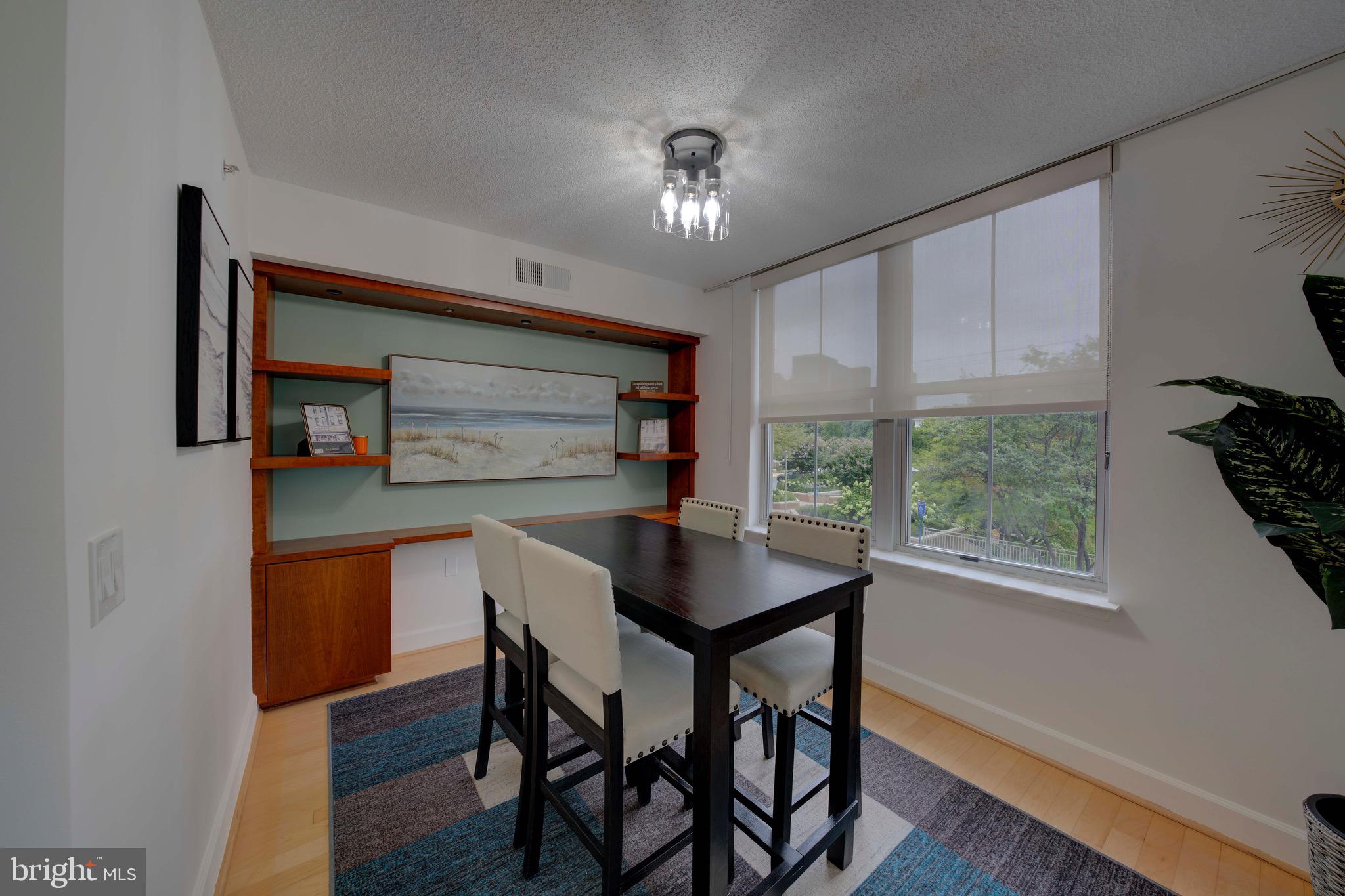 11800 Sunset Hills Road, Unit 222 Reston, VA 20190 - Photo 16 of 70 a dining room with furniture and window