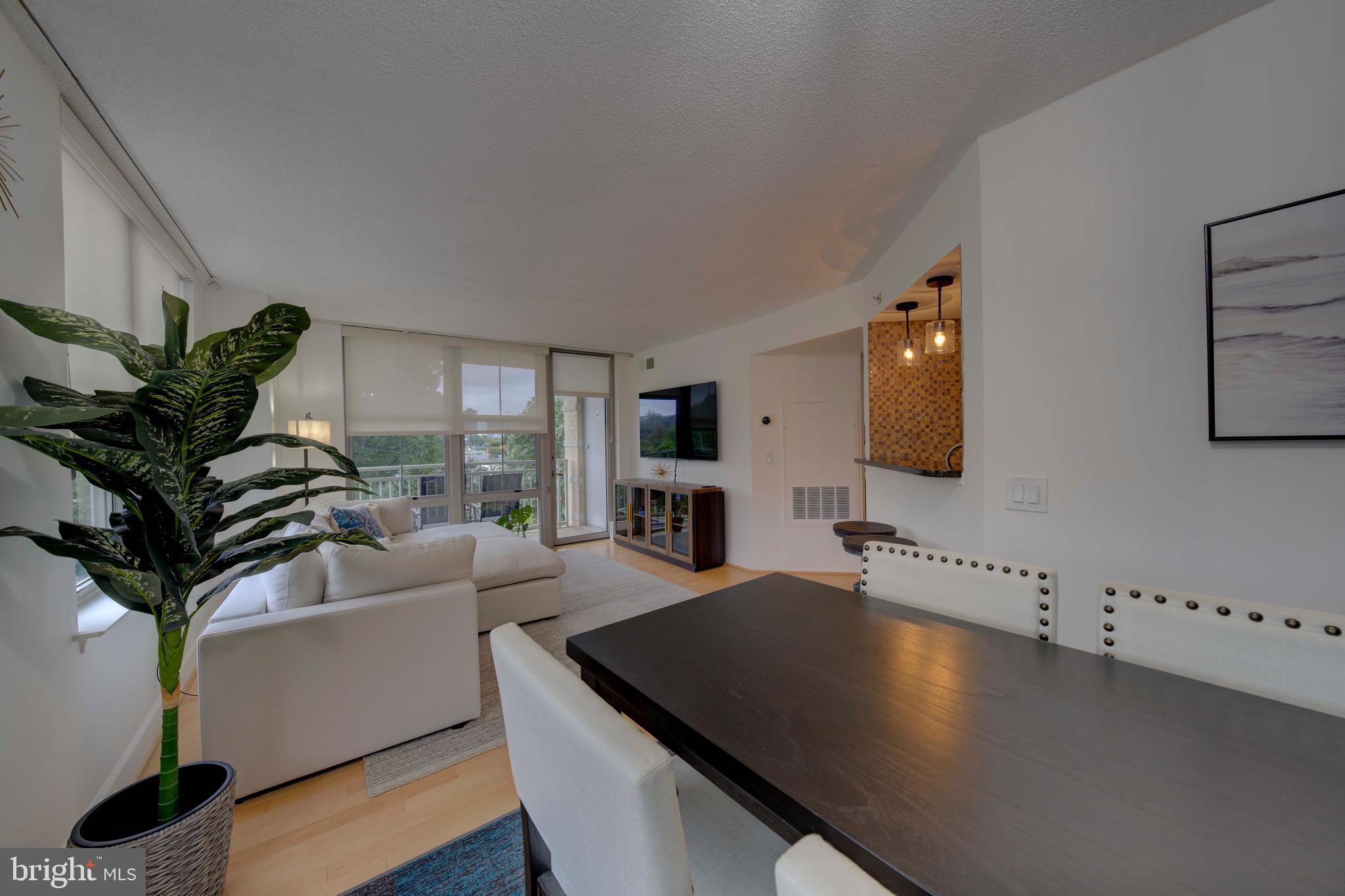 11800 Sunset Hills Road, Unit 222 Reston, VA 20190 - Photo 19 of 70 a living room with furniture and a flat screen tv
